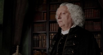 Movie still from “Sleepy Hollow” (1999), directed by Tim Burton – An old man with white hair and a wig; Close Up shot, Over the shoulder angle