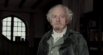 Movie still from “Sleepy Hollow” (1999), directed by Tim Burton – An old man with a beard and a white beard; Close Up shot, Low angle