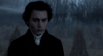Movie still from “Sleepy Hollow” (1999), directed by Tim Burton – A man in a black jacket and a white shirt; Close Up shot, Over the shoulder angle