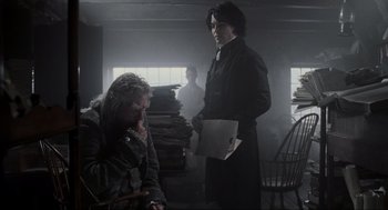 Movie still from “Sleepy Hollow” (1999), directed by Tim Burton – A man standing next to a woman in a room; Medium shot, Over the shoulder angle
