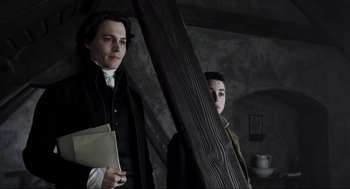 Movie still from “Sleepy Hollow” (1999), directed by Tim Burton – Two men standing next to each other holding papers; Medium shot, High angle