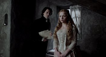 Movie still from “Sleepy Hollow” (1999), directed by Tim Burton – A man and a woman standing next to each other in a room; Medium shot, Over the shoulder angle