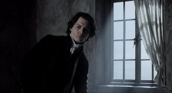 Movie still from “Sleepy Hollow” (1999), directed by Tim Burton – A man standing in front of an open window; Medium shot, Low angle