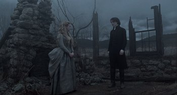Movie still from “Sleepy Hollow” (1999), directed by Tim Burton – A man and a woman standing next to each other; Wide shot, Low angle