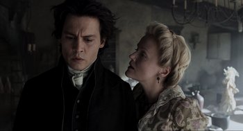 Movie still from “Sleepy Hollow” (1999), directed by Tim Burton – A man and a woman standing next to each other; Close Up shot, Over the shoulder angle