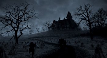 Movie still from “Sleepy Hollow” (1999), directed by Tim Burton – An old house in the middle of a graveyard; Extreme Wide shot, Low angle