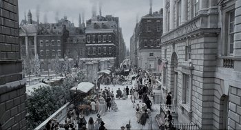 Movie still from “Sleepy Hollow” (1999), directed by Tim Burton – An old painting of a street scene with people walking and sitting on benches; Extreme Wide shot, High angle