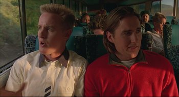 Movie still from “Bottle Rocket” (1996), directed by Wes Anderson – Two men sitting next to each other on a bus; Close Up shot, Low angle