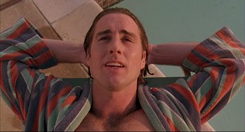 Movie still from “Bottle Rocket” (1996), directed by Wes Anderson – A person laying on a chair; Close Up shot, Low angle