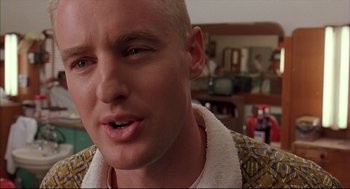 Movie still from “Bottle Rocket” (1996), directed by Wes Anderson – A person with a shaved head; Close Up shot, Low angle
