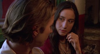 Movie still from “Bottle Rocket” (1996), directed by Wes Anderson – A young man and a young woman looking at one another; Close Up shot, Over the shoulder angle