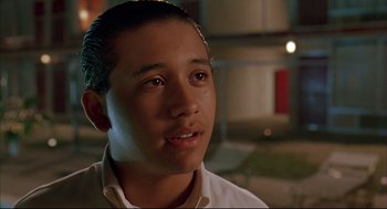 Movie still from “Bottle Rocket” (1996), directed by Wes Anderson – A young man is looking into the distance; Close Up shot, Low angle