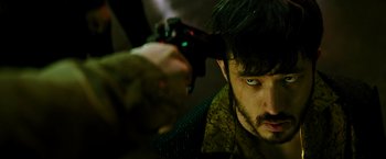 Movie still from “Snake Eyes” (2021), directed by Robert Schwentke – A person holding a remote control; Close Up shot, Over the shoulder angle