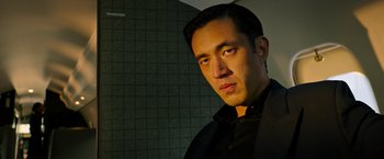 Movie still from “Snake Eyes” (2021), directed by Robert Schwentke – A person wearing a black shirt; Close Up shot, Low angle