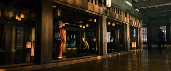 Movie still from “Snake Eyes” (2021), directed by Robert Schwentke – A group of people sitting on the floor of a building; Extreme Wide shot, High angle