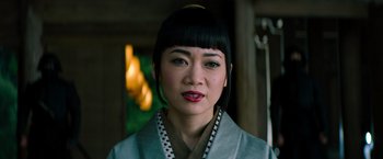 Movie still from “Snake Eyes” (2021), directed by Robert Schwentke – A person wearing a robe; Close Up shot, Low angle