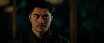 Movie still from “Snake Eyes” (2021), directed by Robert Schwentke – A person wearing a jacket; Close Up shot, Over the shoulder angle