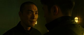 Movie still from “Snake Eyes” (2021), directed by Robert Schwentke – Two men are talking in a dark room; Close Up shot, Over the shoulder angle