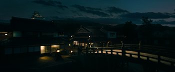 Movie still from “Snake Eyes” (2021), directed by Robert Schwentke – A night view of a bridge and a building; Extreme Wide shot, High angle