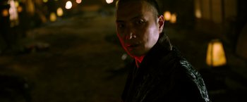 Movie still from “Snake Eyes” (2021), directed by Robert Schwentke – A person wearing a jacket in the dark; Close Up shot, Low angle