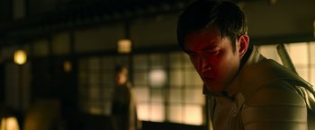 Movie still from “Snake Eyes” (2021), directed by Robert Schwentke – A young man is looking down at his face; Close Up shot, Low angle