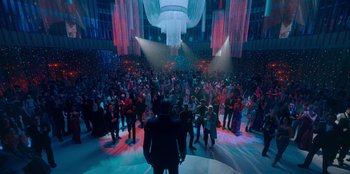 Movie still from “Sneakerella” (2022), directed by Elizabeth Allen Rosenbaum – A crowd of people in a large room; Extreme Wide shot, High angle