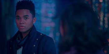 Movie still from “Sneakerella” (2022), directed by Elizabeth Allen Rosenbaum – A man in a black jacket is talking to a woman; Close Up shot, Over the shoulder angle