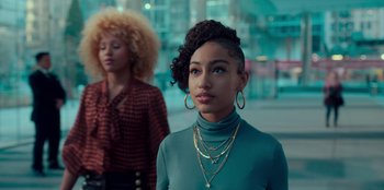 Movie still from “Sneakerella” (2022), directed by Elizabeth Allen Rosenbaum – A woman in a green shirt and a woman in a red shirt; Medium shot, Low angle