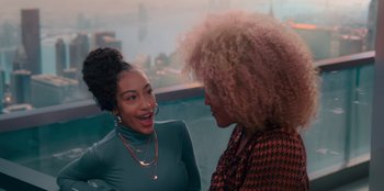 Movie still from “Sneakerella” (2022), directed by Elizabeth Allen Rosenbaum – Two women talking to each other while sitting in a room; Medium shot, Over the shoulder angle