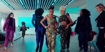 Movie still from “Sneakerella” (2022), directed by Elizabeth Allen Rosenbaum – A group of women standing next to each other in a room; Wide shot, Over the shoulder angle