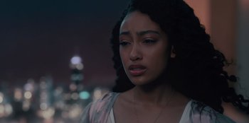 Movie still from “Sneakerella” (2022), directed by Elizabeth Allen Rosenbaum – A person wearing a necklace; Close Up shot, High angle