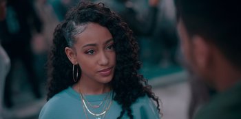 Movie still from “Sneakerella” (2022), directed by Elizabeth Allen Rosenbaum – A person wearing a blue shirt; Close Up shot, Over the shoulder angle