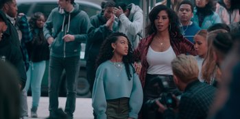 Movie still from “Sneakerella” (2022), directed by Elizabeth Allen Rosenbaum – A woman and a young girl walking down a street; Medium shot, Over the shoulder angle