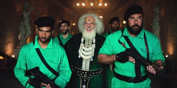 Movie still from “Sniper: G.R.I.T. - Global Response & Intelligence Team” (2023), directed by Oliver Thompson – A group of men dressed in green and black; Medium shot, Low angle