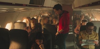 Movie still from “Sniper: G.R.I.T. - Global Response & Intelligence Team” (2023), directed by Oliver Thompson – A group of people sitting on a plane; Medium shot, High angle
