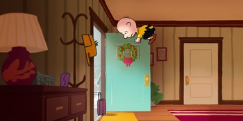 Movie still from “Snoopy Presents: For Auld Lang Syne” (2021), directed by Clay Kaytis – A charlie brown character hanging from a door; Extreme Wide shot, High angle