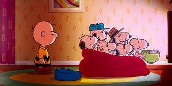 Movie still from “Snoopy Presents: For Auld Lang Syne” (2021), directed by Clay Kaytis – A group of peanuts sitting on top of a couch; Extreme Wide shot, High angle