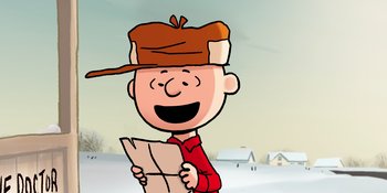 Movie still from “Snoopy Presents: For Auld Lang Syne” (2021), directed by Clay Kaytis – Charlie brown is wearing a hat while reading a newspaper; Close Up shot, Low angle