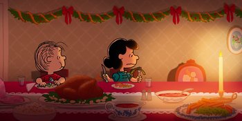 Movie still from “Snoopy Presents: For Auld Lang Syne” (2021), directed by Clay Kaytis – A woman sitting at a dinner table with a turkey; Extreme Wide shot, High angle