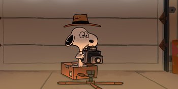 Movie still from “Snoopy Presents: For Auld Lang Syne” (2021), directed by Clay Kaytis – A drawing of a dog taking a picture with a camera; Extreme Close Up shot, High angle