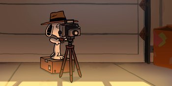 Movie still from “Snoopy Presents: For Auld Lang Syne” (2021), directed by Clay Kaytis – A dog is taking a picture with a camera; Wide shot, High angle