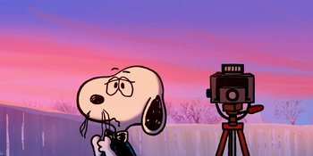 Movie still from “Snoopy Presents: For Auld Lang Syne” (2021), directed by Clay Kaytis – A drawing of a dog holding a camera and taking a picture of it; Extreme Close Up shot, Low angle