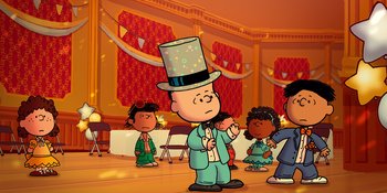 Movie still from “Snoopy Presents: For Auld Lang Syne” (2021), directed by Clay Kaytis – A charlie brown character wearing a top hat; Extreme Wide shot, High angle