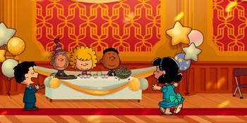 Movie still from “Snoopy Presents: For Auld Lang Syne” (2021), directed by Clay Kaytis – A group of people sitting around a table; Extreme Wide shot, High angle