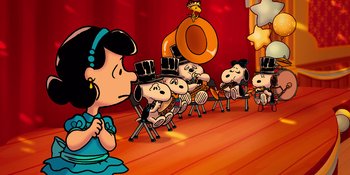 Movie still from “Snoopy Presents: For Auld Lang Syne” (2021), directed by Clay Kaytis – A group of peanuts characters sitting in chairs; Extreme Wide shot, High angle