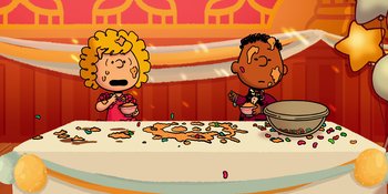 Movie still from “Snoopy Presents: For Auld Lang Syne” (2021), directed by Clay Kaytis – Two people sitting at a table with food on it; Extreme Wide shot, High angle