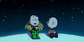 Movie still from “Snoopy Presents: For Auld Lang Syne” (2021), directed by Clay Kaytis – A couple of people that are sitting in the snow; Extreme Wide shot, High angle