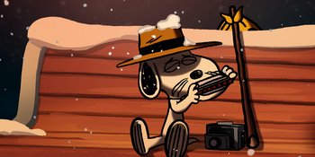 Movie still from “Snoopy Presents: For Auld Lang Syne” (2021), directed by Clay Kaytis – A cartoon of a dog wearing a cowboy hat and sitting on the ground; Extreme Close Up shot, High angle