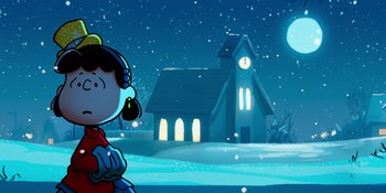 Movie still from “Snoopy Presents: For Auld Lang Syne” (2021), directed by Clay Kaytis – A girl standing in front of a church at night; Extreme Wide shot, Low angle