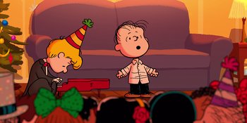 Movie still from “Snoopy Presents: For Auld Lang Syne” (2021), directed by Clay Kaytis – A charlie brown and a girl in a party hat; Extreme Wide shot, High angle